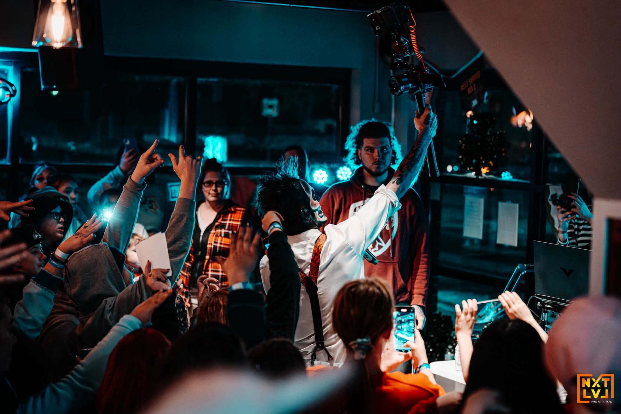 Brian Durst reaching toward fans during a performance.